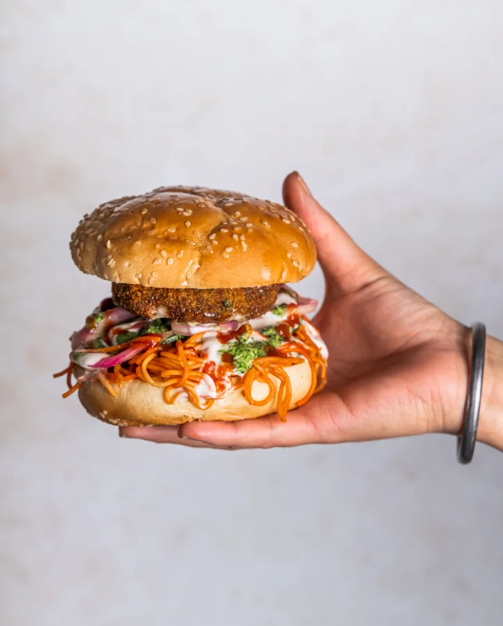 Aloo Tikki Noodle Burger - Signature Desi burger at Sector 17 Indian Eatery Sage Hill Calgary